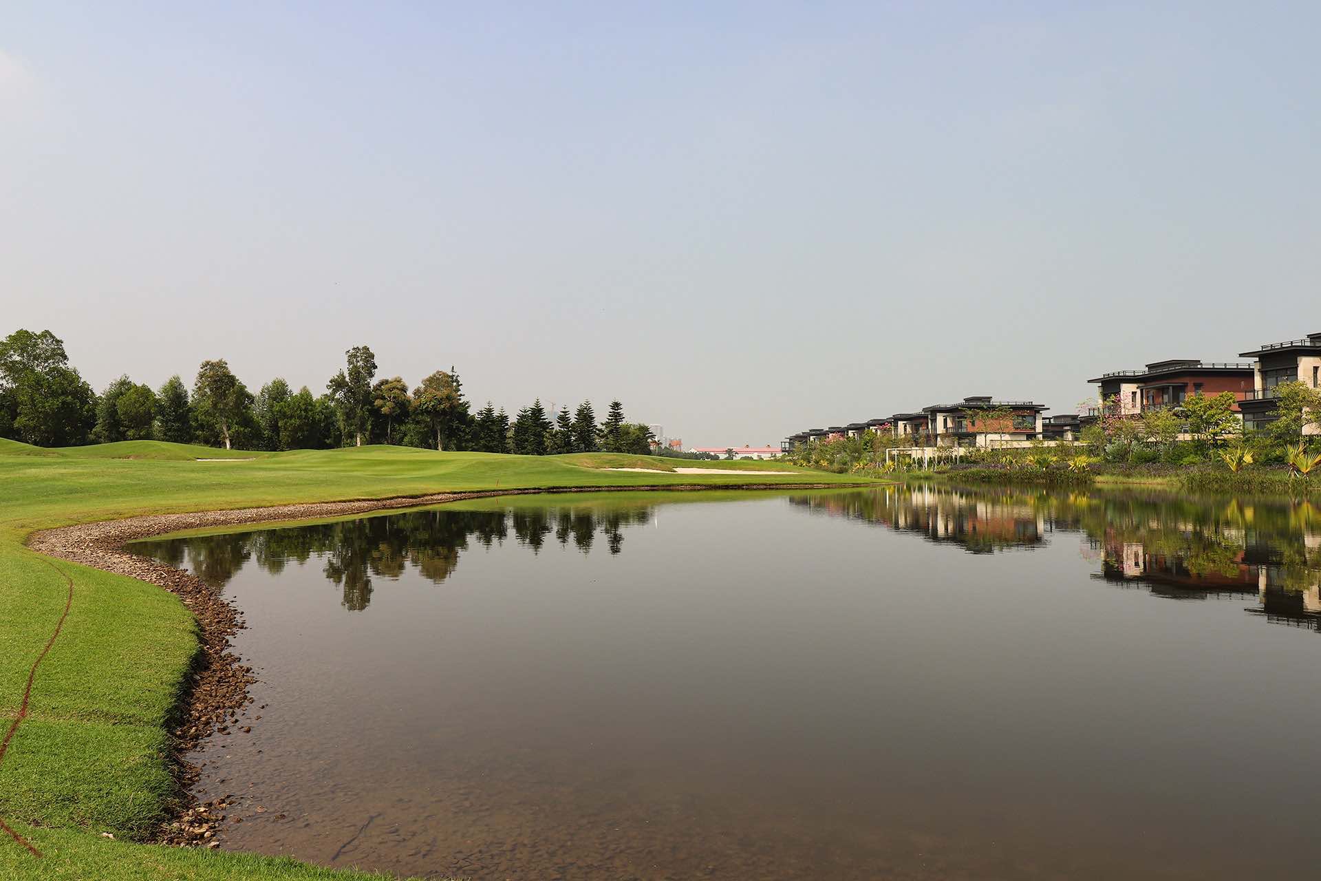 Zhuhai Golden Gulf Golf Club photo across water photo featuring par-3 green