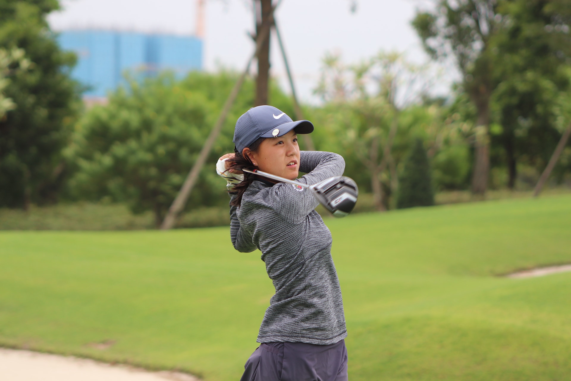 Tina Kong swinging in the windy start of The Southern Junior in round one
