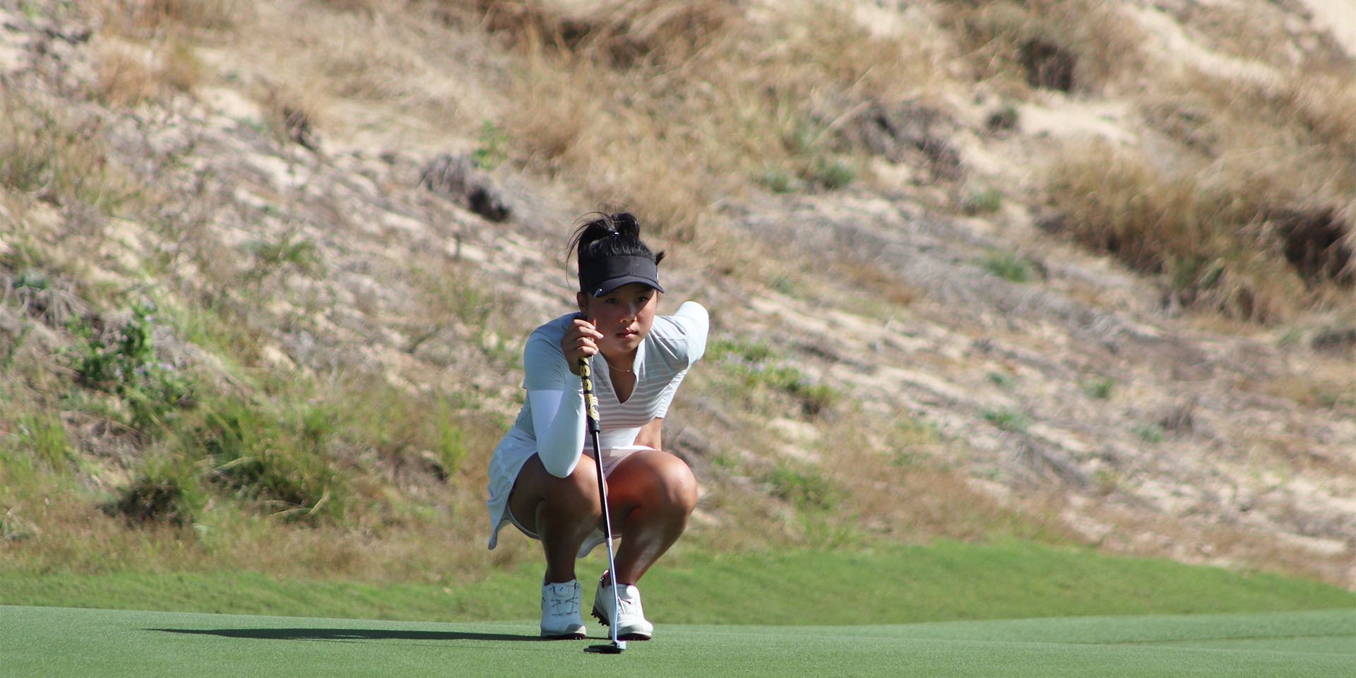 Yu Wen Lu reading her putt at the JGTA Junior Aspirations at The Bluffs, one of the many players from the JGTA leading the charge in the fight against Covid-19